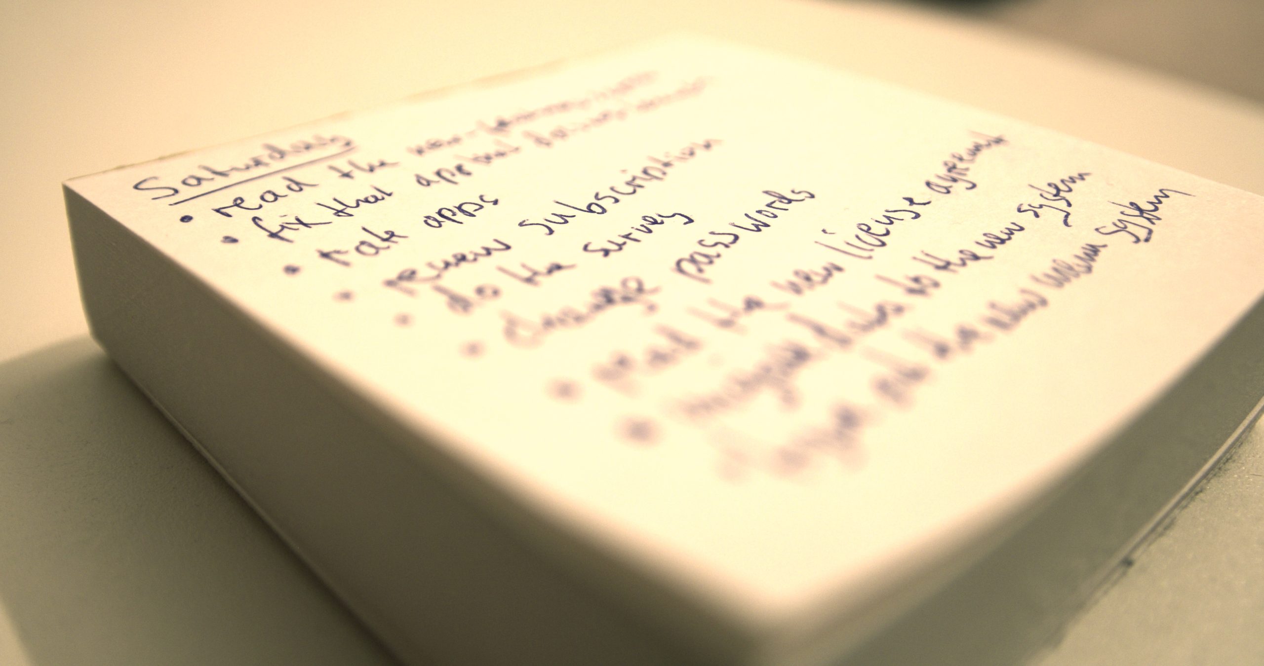 a notepad with a written list of annoying things to do